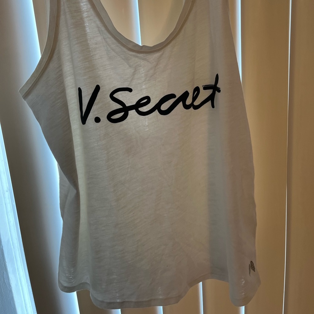 A white tank top from Victoria’s Secret. This is a size medium.